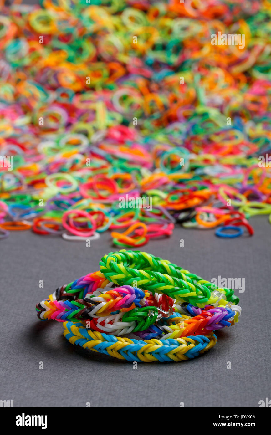 Pile pink rubber loom bands hi-res stock photography and images - Alamy