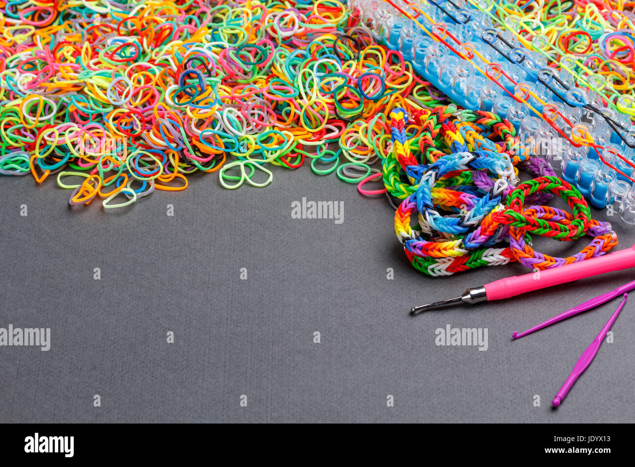 Rubber loom bands used to produce colourful wrist bands Stock Photo Alamy
