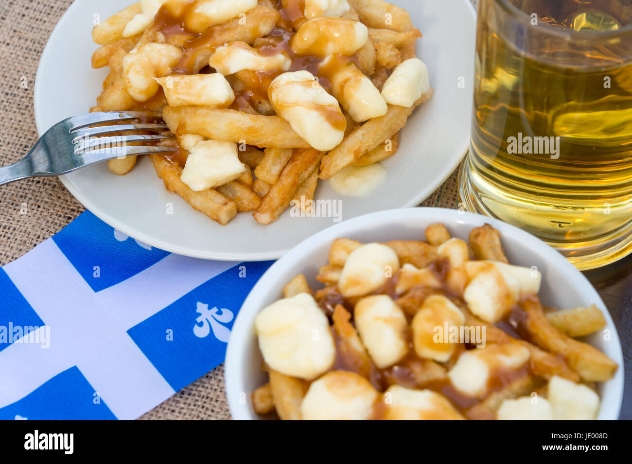 Classic Quebec poutine with french fries, gravy, and cheese curds Stock