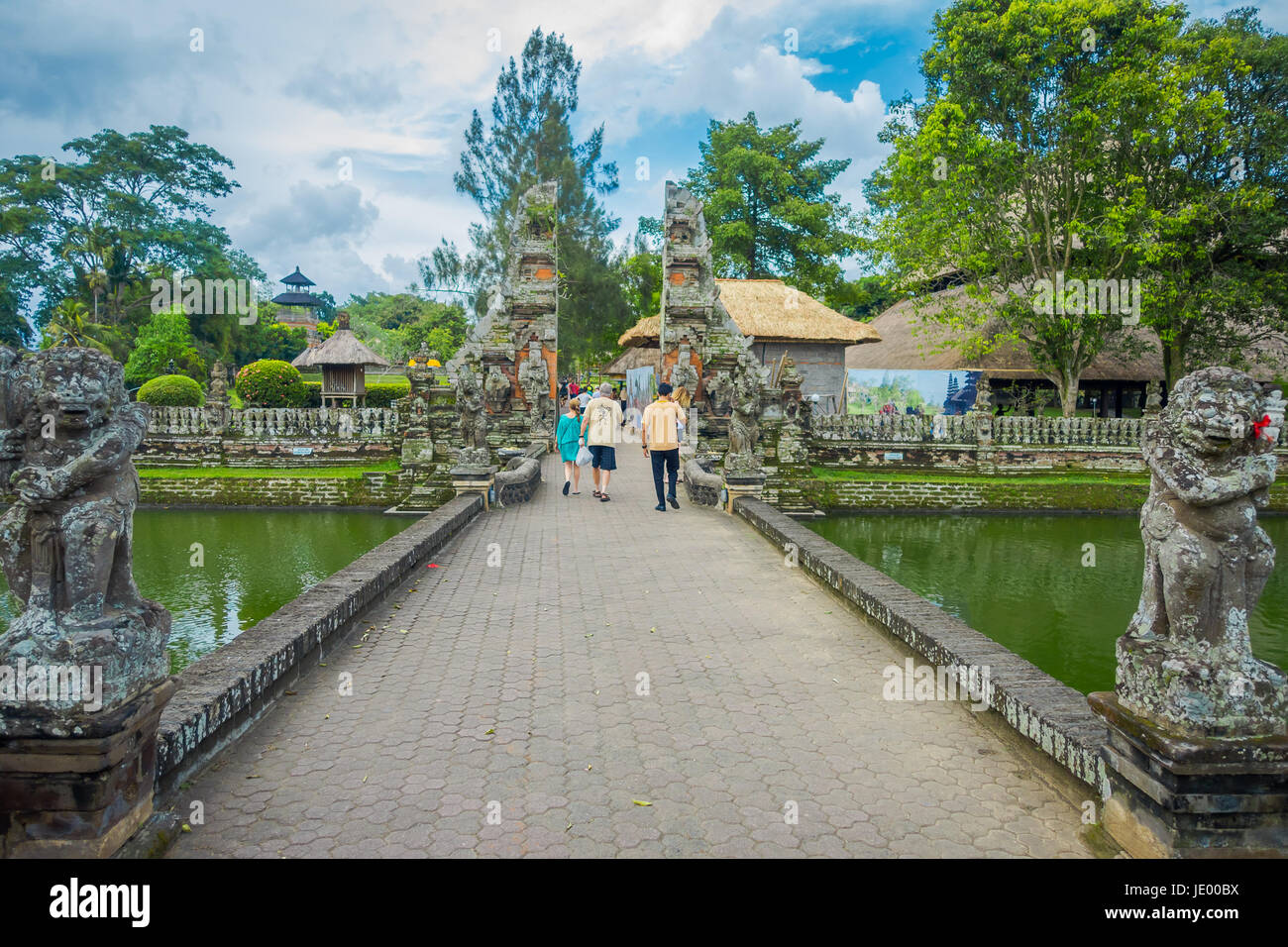 People walking inside of the temple of Mengwi Empire located in Mengwi, Badung regency that is famous places of interest in Bali, Indonesia. Stock Photo