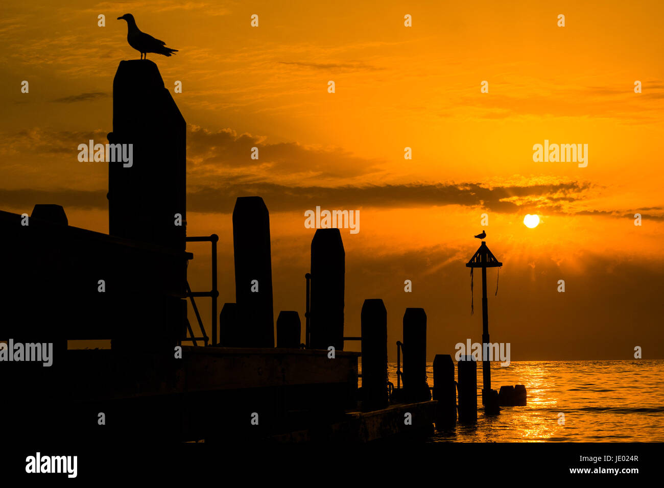 Aberystwyth Wales UK, Wednesday 21 June 2017 UK Weather: A spectacular summer solstice sunset over the seas of Cardigan Bay in Aberystwyth, Wales at the end of the longest day of the year Credit: keith morris/Alamy Live News Stock Photo