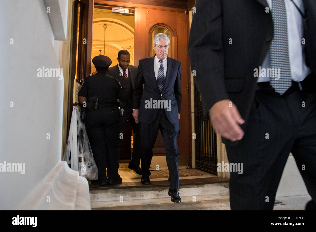 Washington, USA. 21st June, 2017. Former FBI Director Robert Mueller (C), the special counsel probing Russian interference in the 2016 U.S. election, leaves the Capitol building after meeting with the Senate Judiciary Committee on Capitol Hill in Washington, DC, the United States, on June 21, 2017. Credit: Ting Shen/Xinhua/Alamy Live News Stock Photo