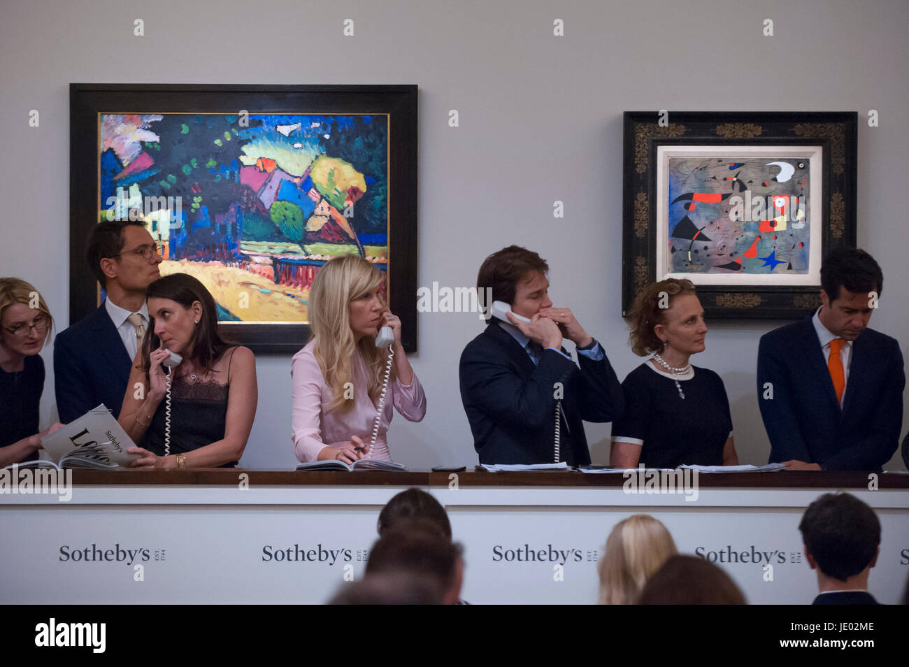 London, UK.  21 June 2017.(L to R) 'Murnau - Landschaft mit grünem Haus', 1909, by Wassily Kandinsky sold for a hammer price of GBP18.5m (estimate GBP15-25m) and 'Femme et oiseaux', 1940, by Joan Miró sold for a hammer price of GBP21.7m (estimate > USD30m) at Sotheby's Impressionist and Modern Art evening sale in New Bond Street. Credit: Stephen Chung / Alamy Live News Stock Photo