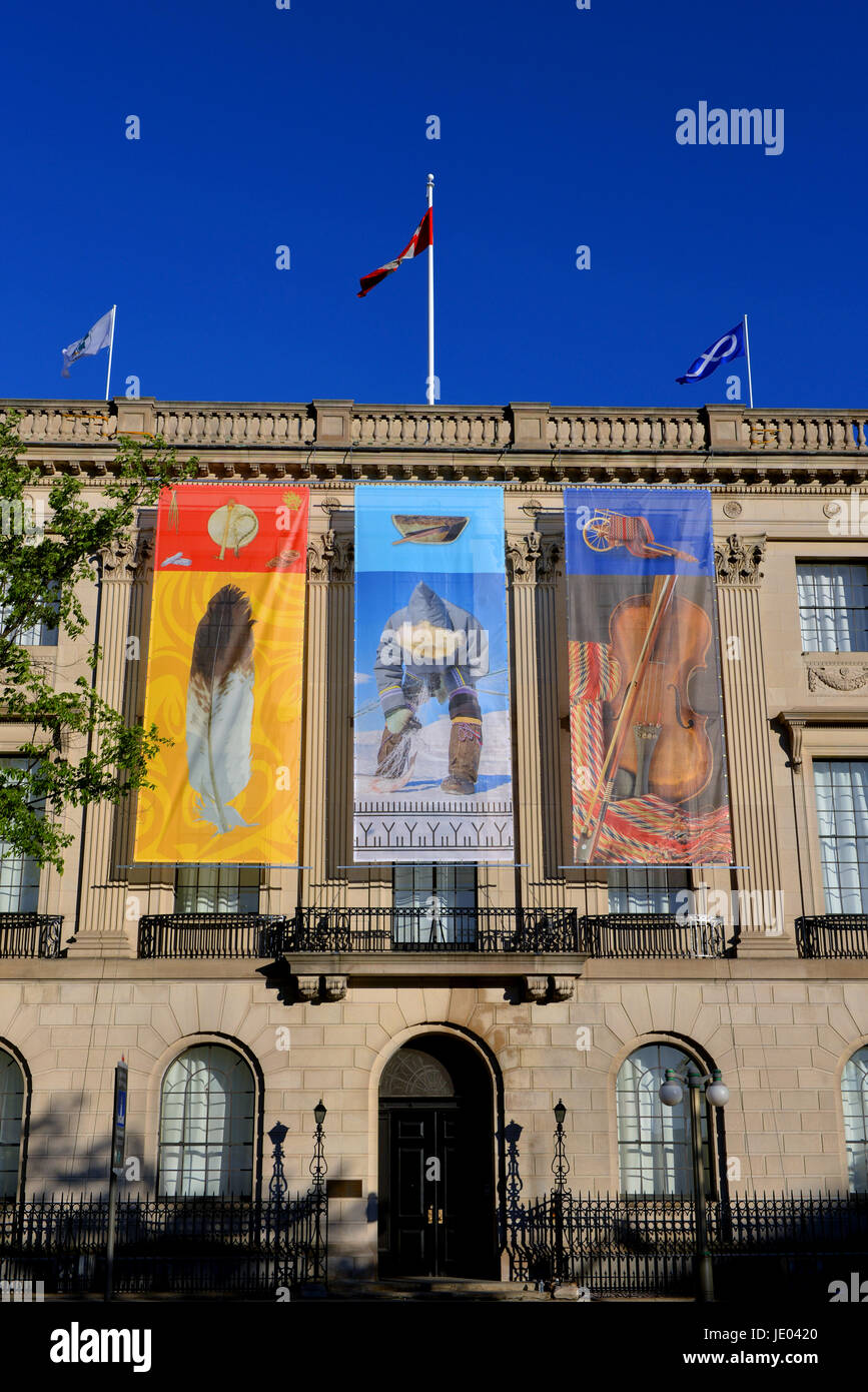 Ottawa, Canada - June 21, 2017:  Three native themed banners are added to the former US embassy, across from Parliament Hill, during a ceremony on National Indigenous Peoples Day, formerly known as National Aboriginal Day.  It was recently announced the building will be converted to a centre dedicated to Indigenous people. Credit: Paul McKinnon/Alamy Live News Stock Photo