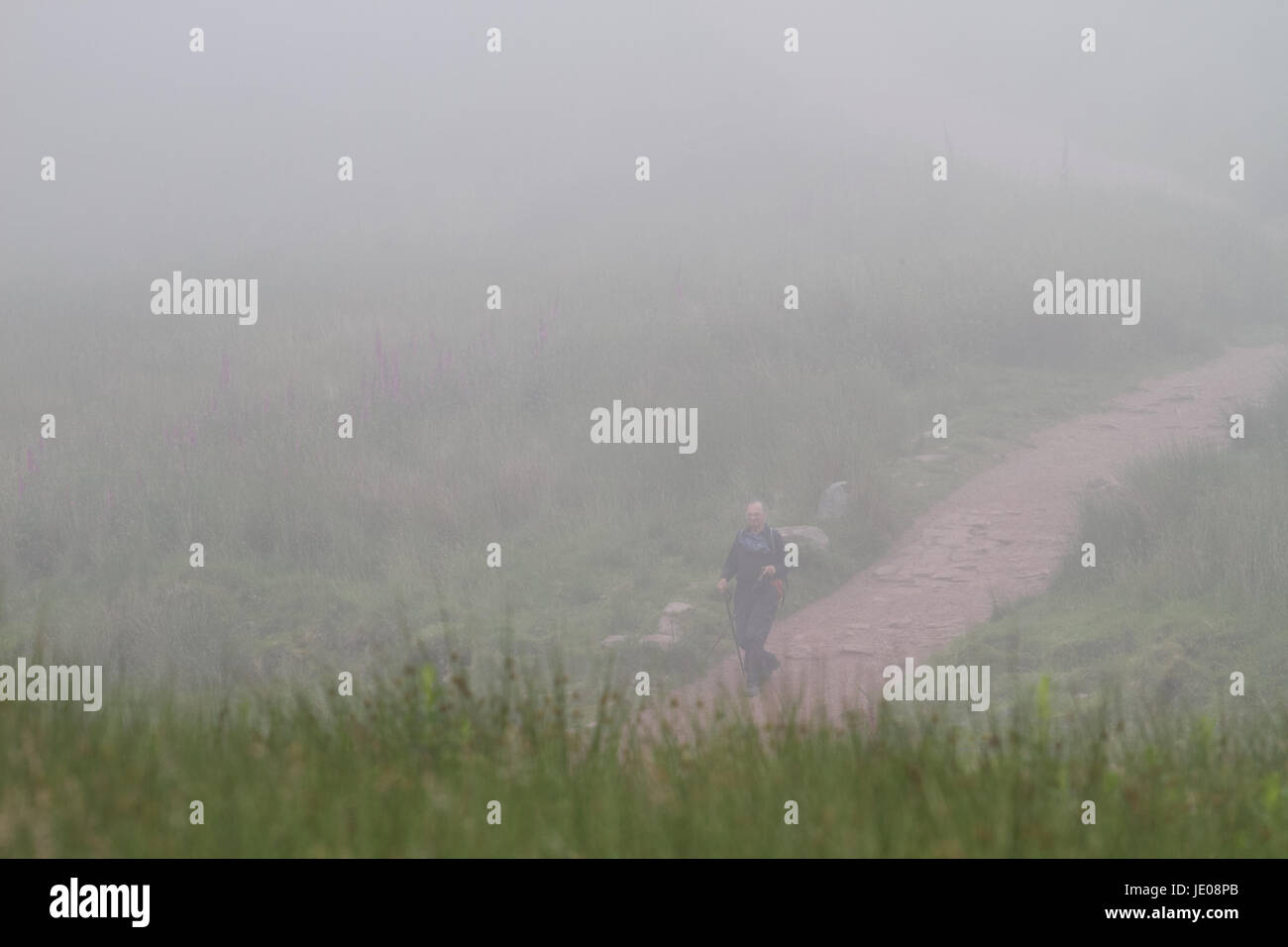 Pont-Yr Daf, Brecon Beacons, South Wales. 22 June 2017.  UK weather: A ramblers decends Pen-Y-Fan today in severe fog, as the warm weather comes to an end.  Credit: Andrew Bartlett/Alamy Live News Stock Photo