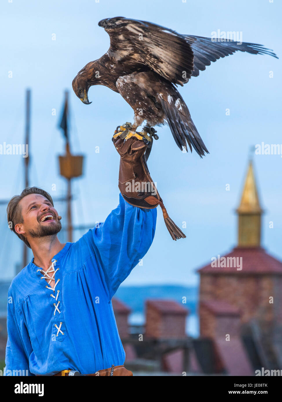 Bastian Semm as the pirate Klaus Stoertebeker and the eagle 'Laran' can be seen during a press viewing of the Stoertebeker Festival on the natural stage Ralswiek on the island Ruegen, Germany, 21 June 2017. This years performance with the titel 'In the shadow of death' will premiere on the 24th of June 2017. The Stoertebeker Festival has been taking place at the island Ruegen for 25 years now. Photo: Jens Büttner/dpa-Zentralbild/dpa Stock Photo