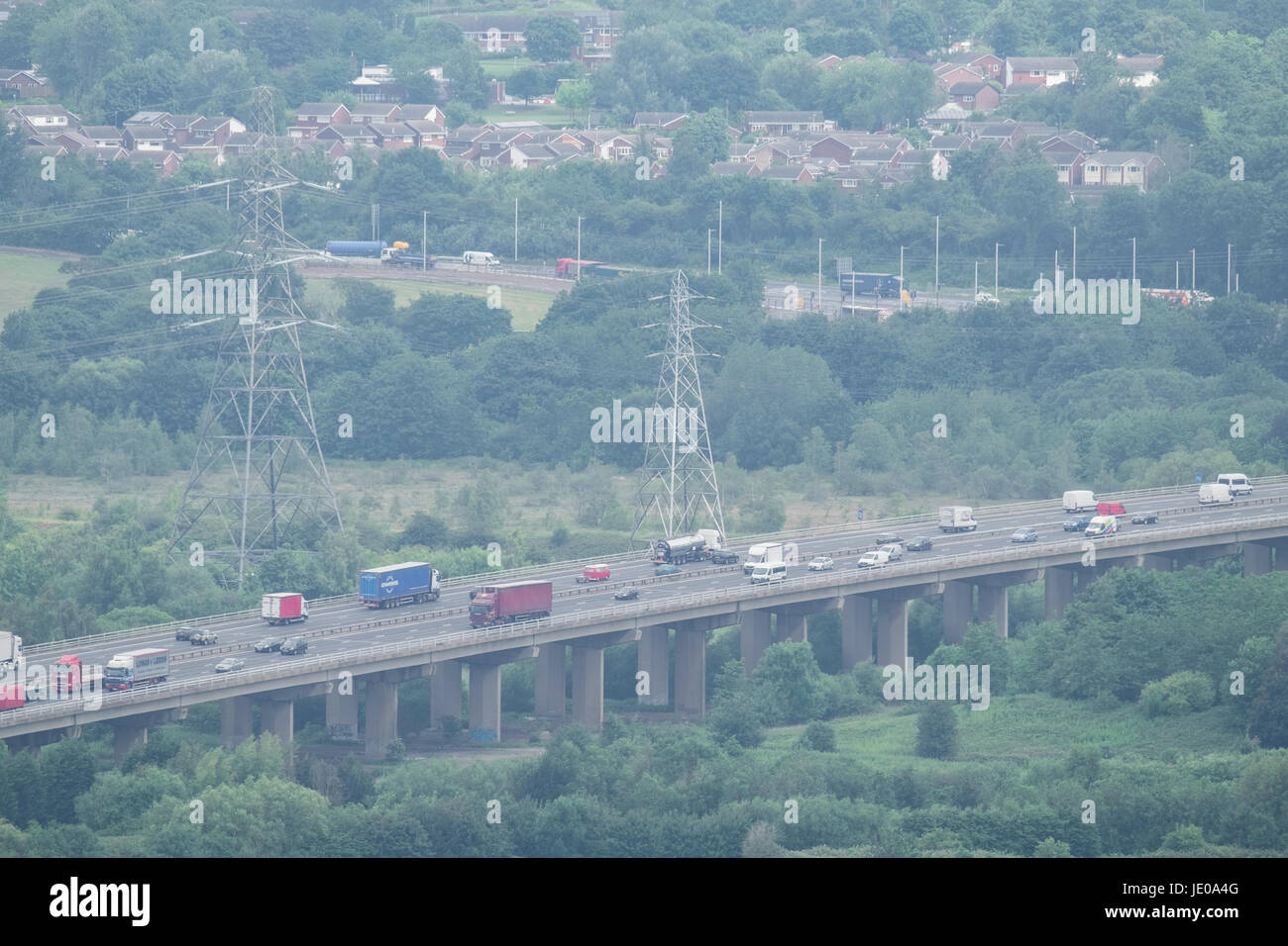 Frodsham Hill, Cheshire, UK. 22nd Jun, 2017. Traffic on the M56 motorway crossing Weaver Viaduct. Cloudy weather across the north west of England as seen from Frodsham Hill in Cheshire on Thursday, June 22, 2017, following record high temperatures over previous days. Credit: Christopher Middleton/Alamy Live News Stock Photo