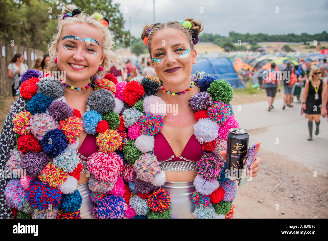 Glastonbury, UK. 22nd June, 2017. Glasto fashion, Home made pom pom coats - The 2017 Glastonbury Festival, Worthy Farm. Glastonbury, 2 June 2017 Credit: Guy Bell/Alamy Live News Stock Photo