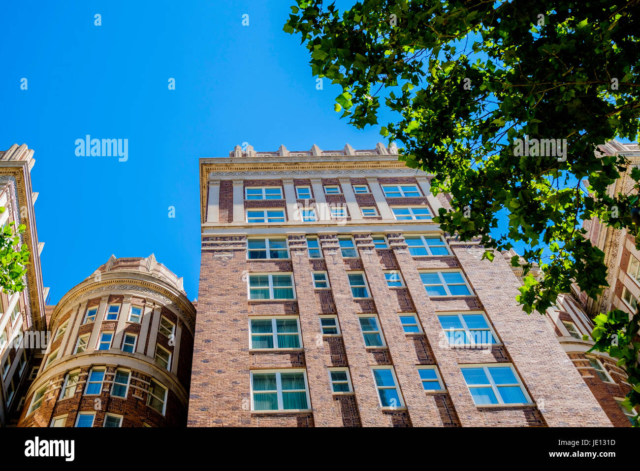 Top of historic Skirvin Hilton hotel building showing architecture, in downtown Oklahoma City, OK, USA, built 1910 complete with a ghost. Stock Photo