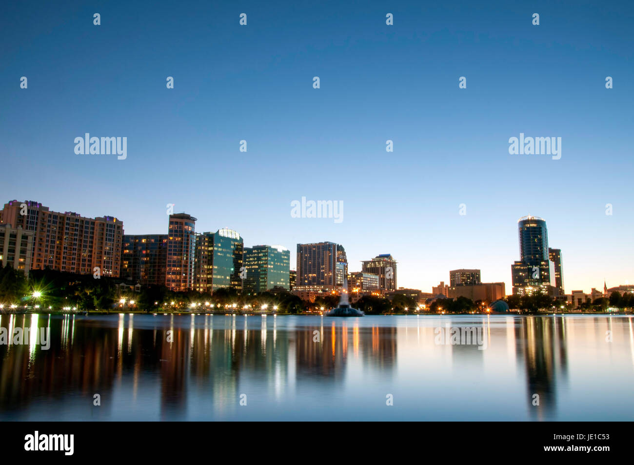 orlando-florida-city-skyline-at-night-reflected-on-lake-eola-stock
