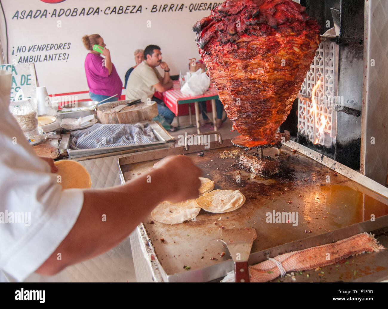 Taco stand with the famous MEAT TROMPO, normaly called (tacos al pastor