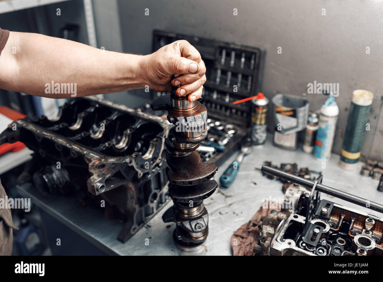 mechanic repairman at automobile car engine maintenance repair work