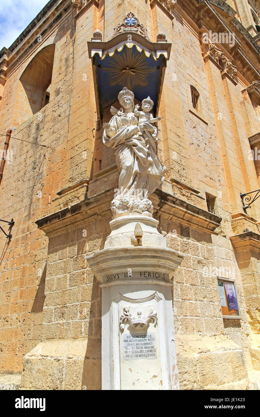 Madonna and baby Jesus Christ statue, Carmelite church and priory in medieval city of Mdina, Malta Stock Photo