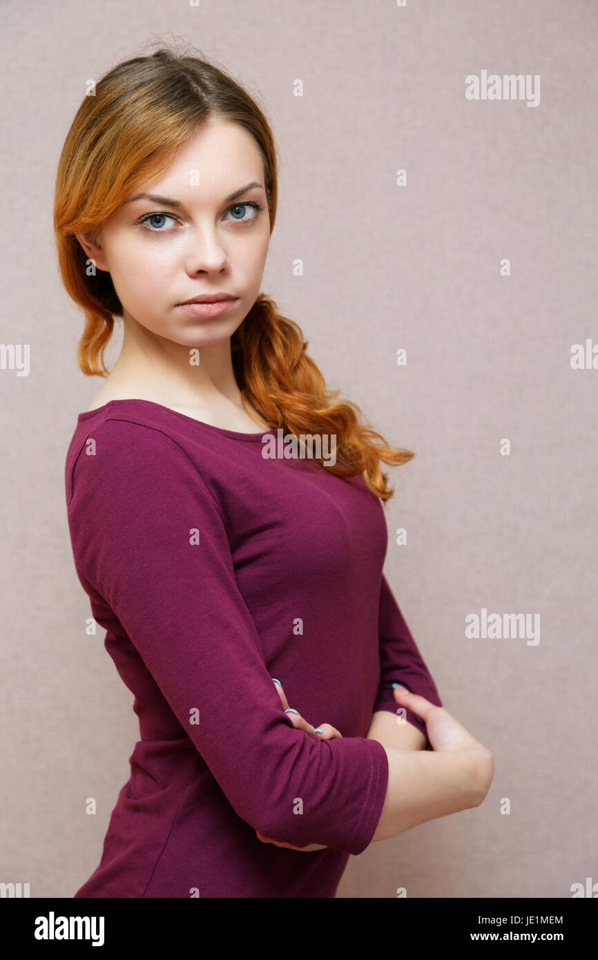 Portrait of a girl in a lilac dress in studio Stock Photo