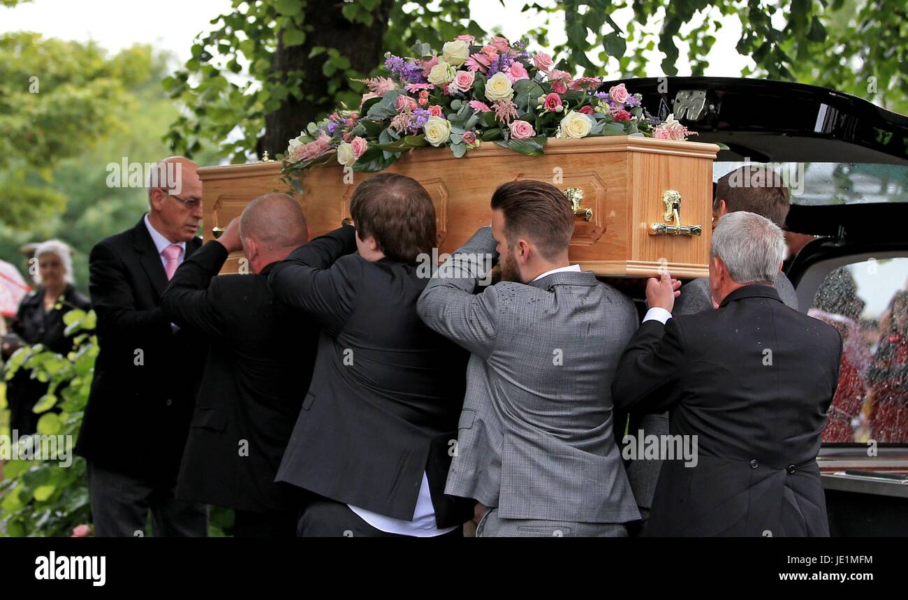 The coffin of Nell Jones, 14, who was killed in the Manchester Arena bombing, is carried to Saint Michaels and All Angels Church in Middlewich, Cheshire. Stock Photo