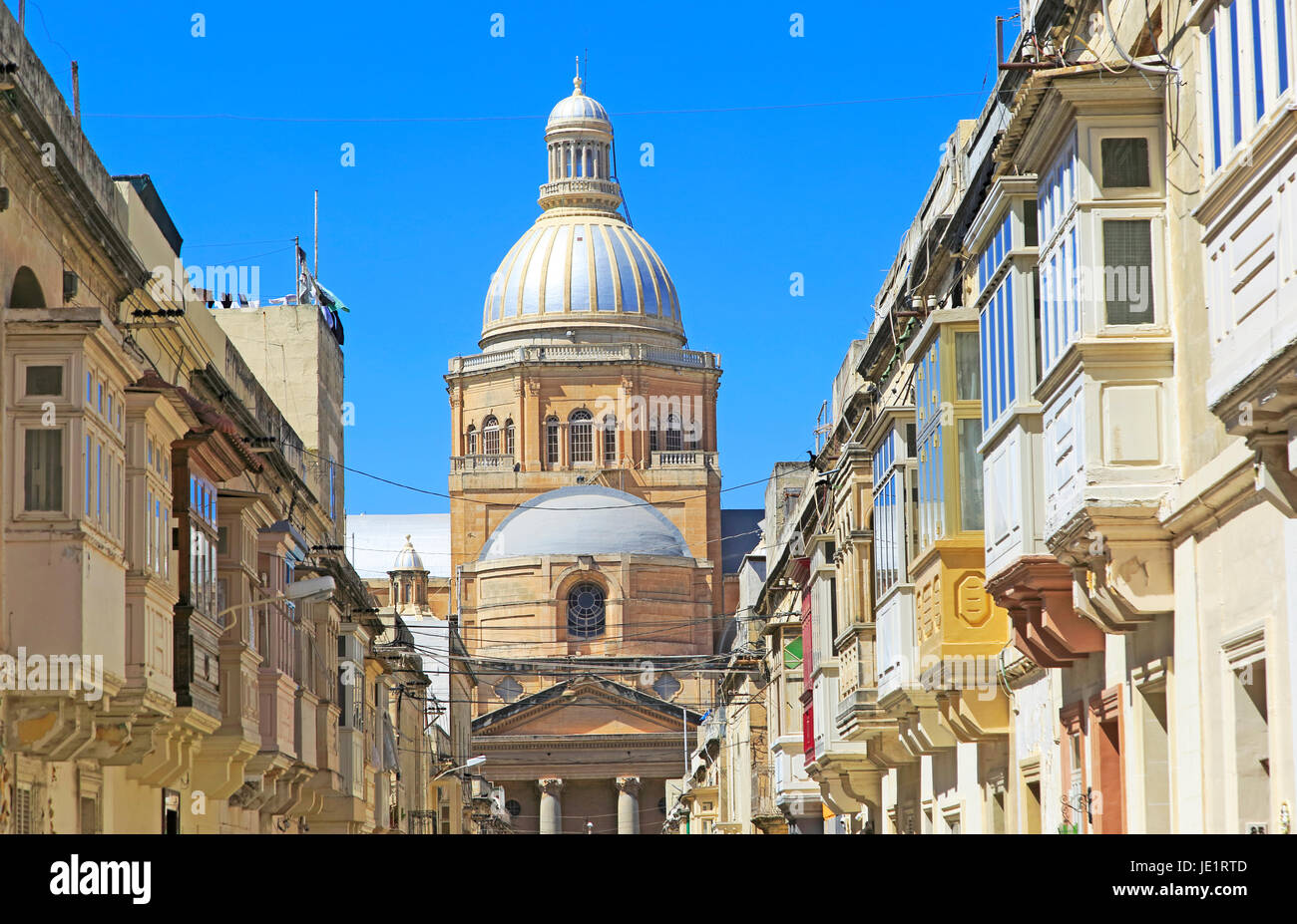 Traditional houses with balconies dome of Paola parish church, Tarxien