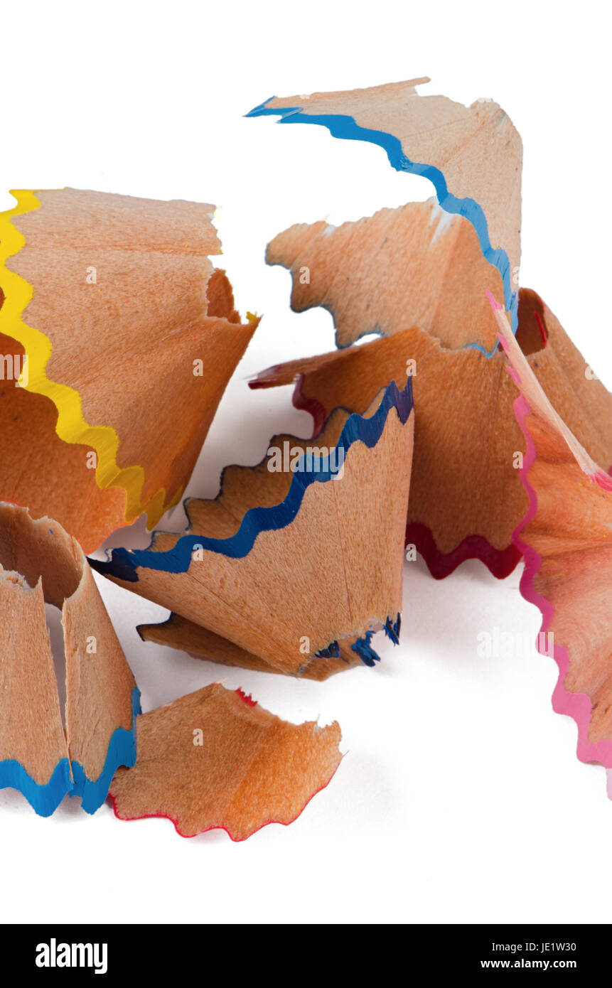 red, blue, yellow and green pencil shaving on white background. Stock Photo