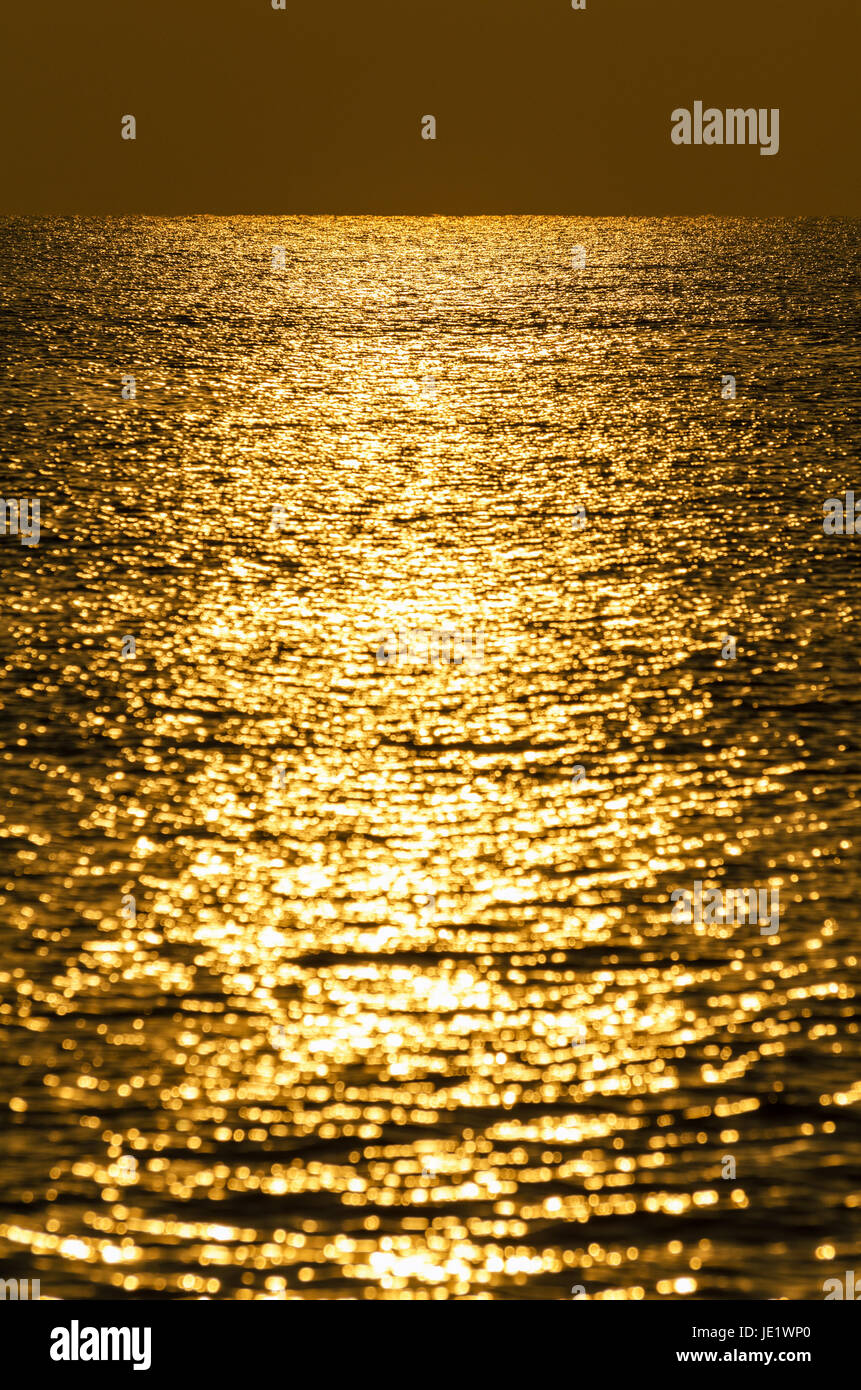 Background of water with golden sunrise reflections Stock Photo - Alamy