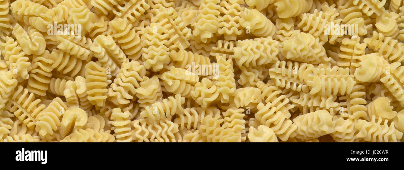 full frame italian pasta background with lots of Radiatori noodles Stock Photo