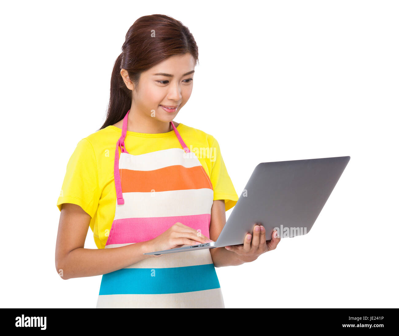 Asian housewife use of laptop computer Stock Photo - Alamy