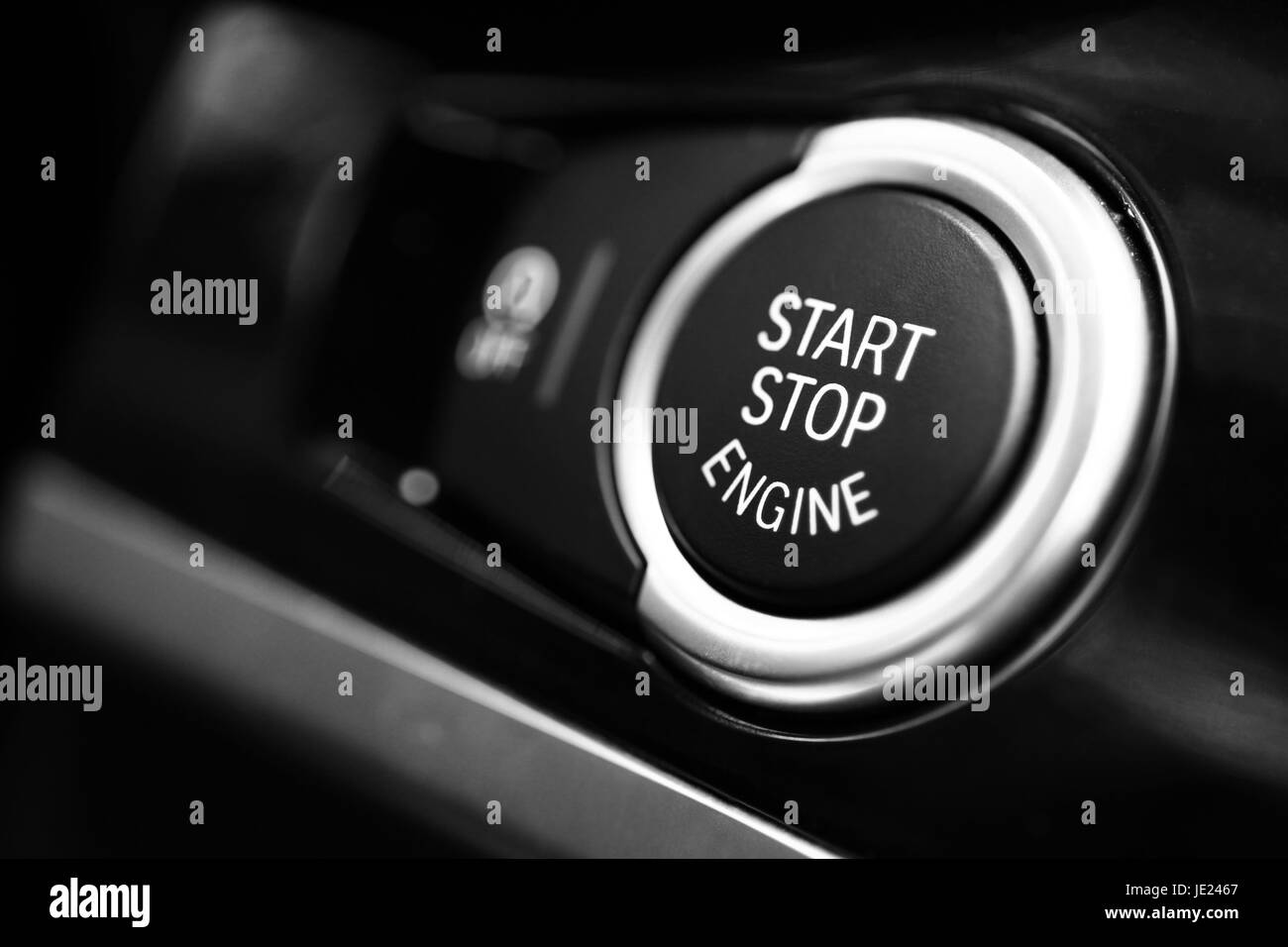 Detail on a black start button in a car. Stock Photo