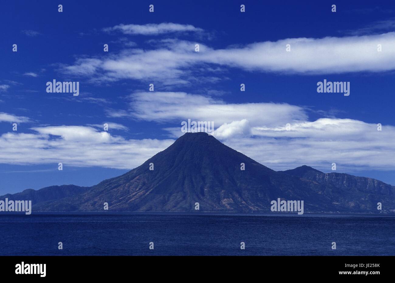 The Lake Atitlan mit the Volcanos of Toliman and San Pedro in the back at the Town of Panajachel in Guatemala in central America. Stock Photo