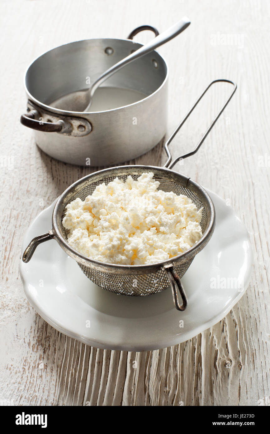 Making Fresh cottage cheese on wooden background Stock Photo