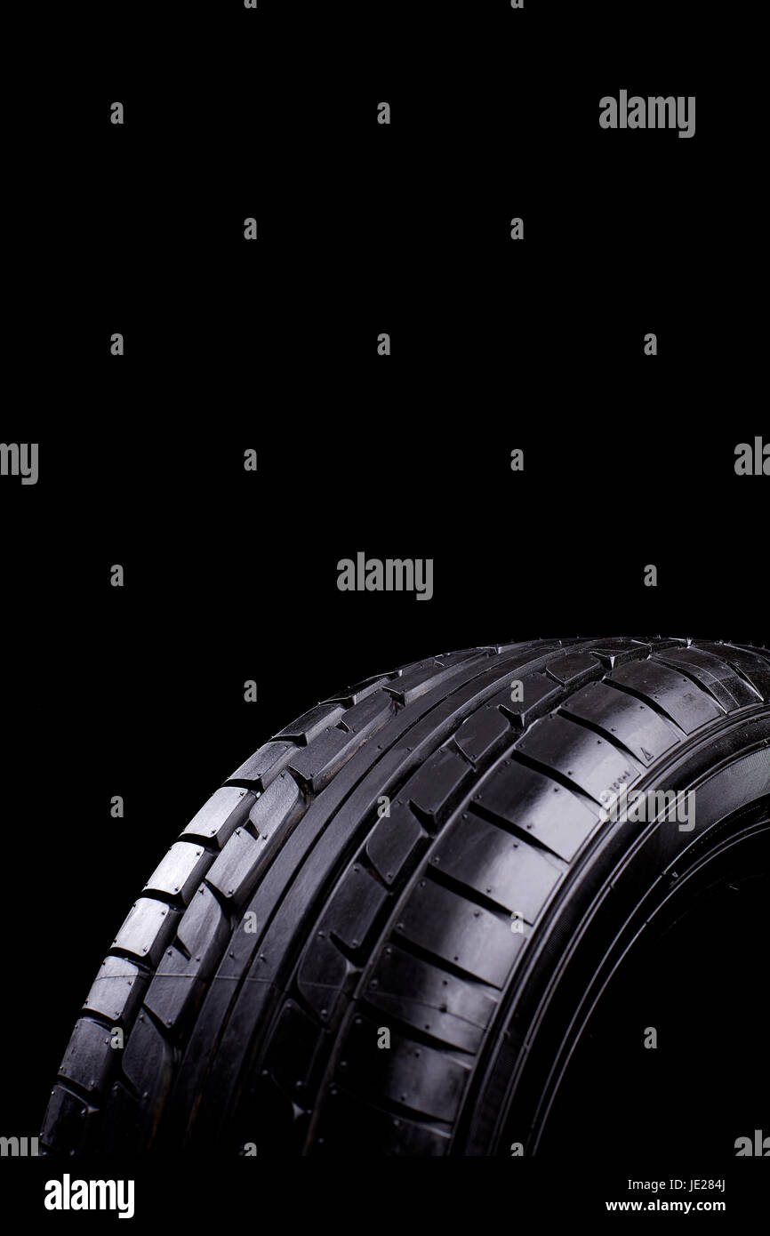 car tires before black background edgewise Stock Photo