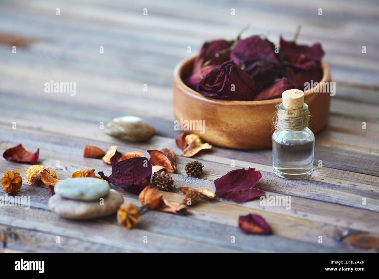 Rose petals and vial with rose essence Stock Photo Alamy