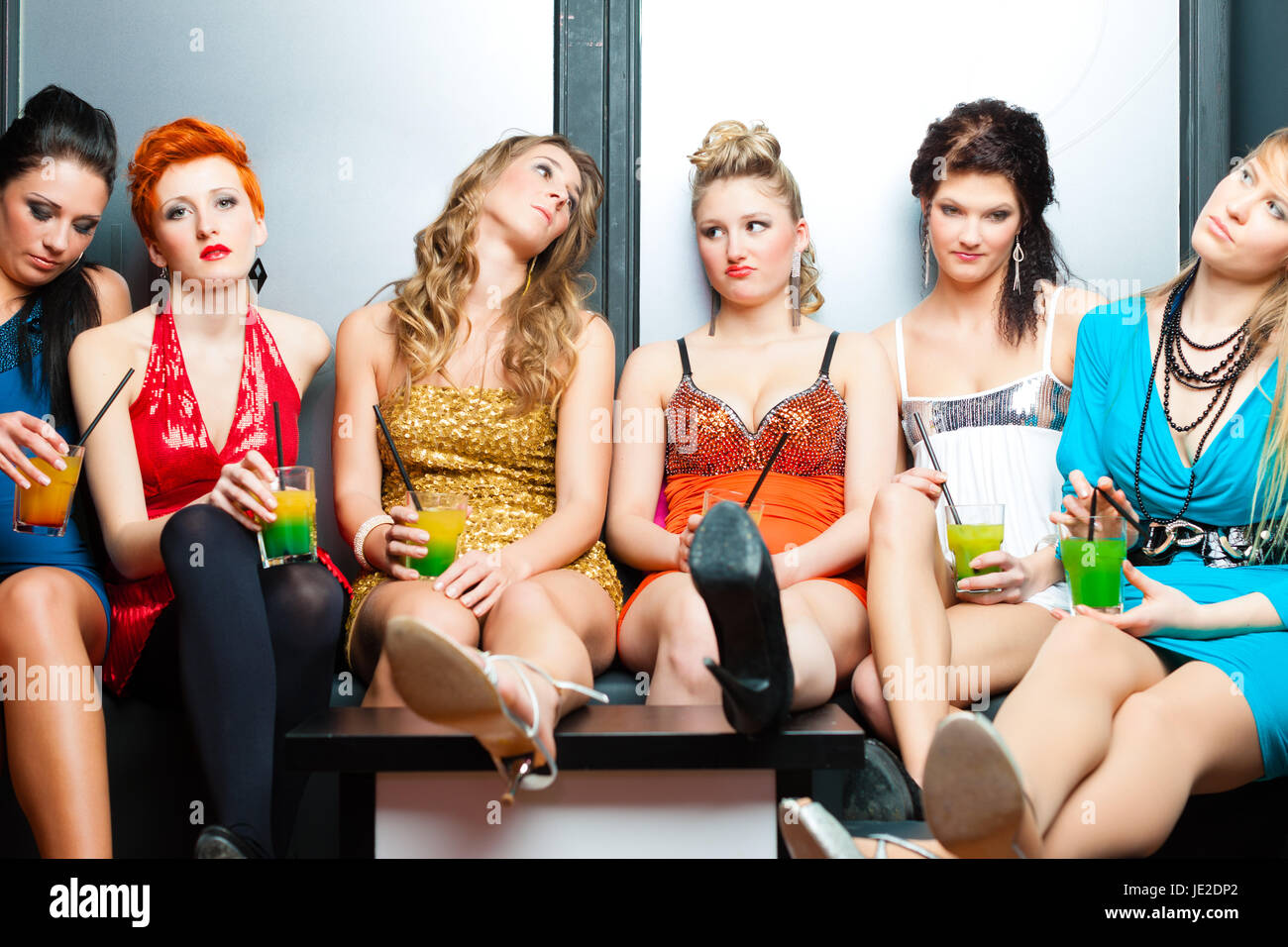 Women Or Models In Club Or Disco Drinking Cocktails Having No Fun As 