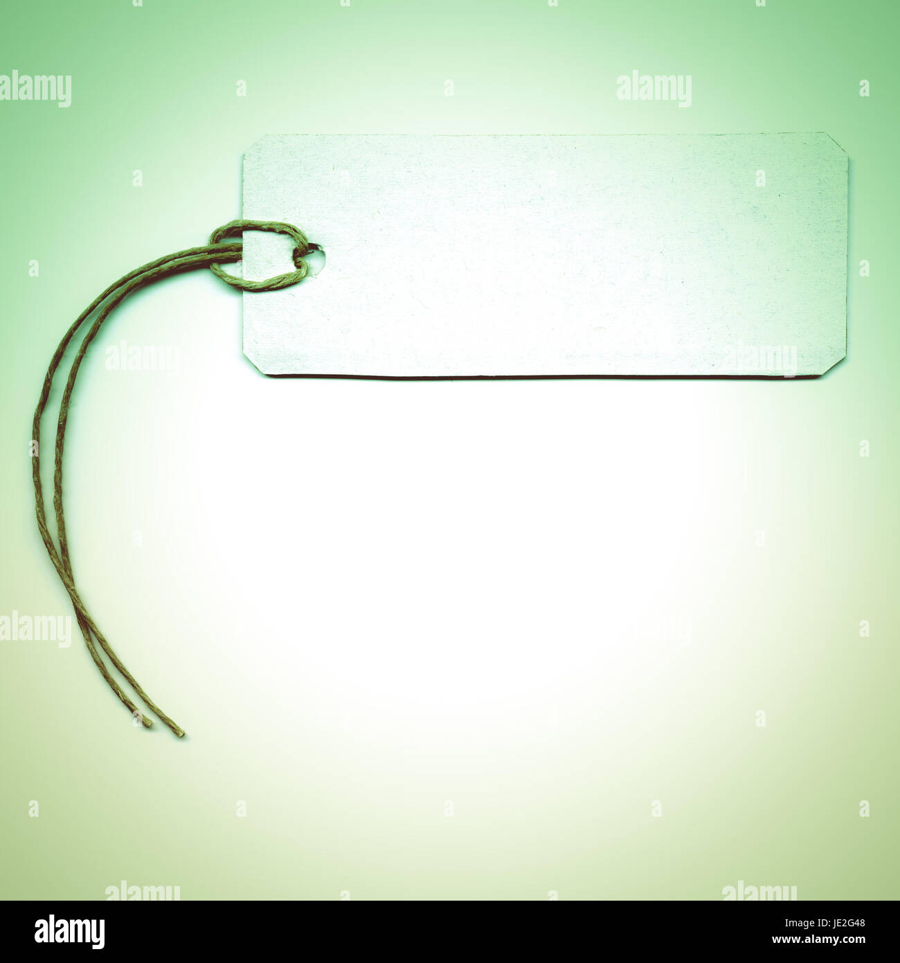 Vintage looking Tag or address label with string Stock Photo - Alamy