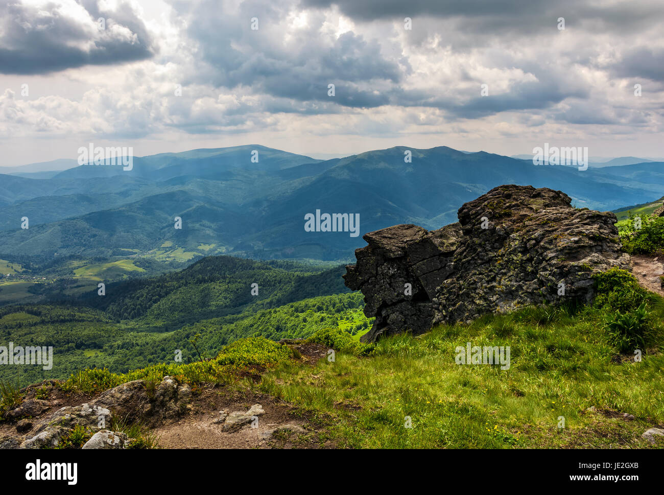 huge stone on the edge of a hill. beautiful valley view from the top Stock Photo