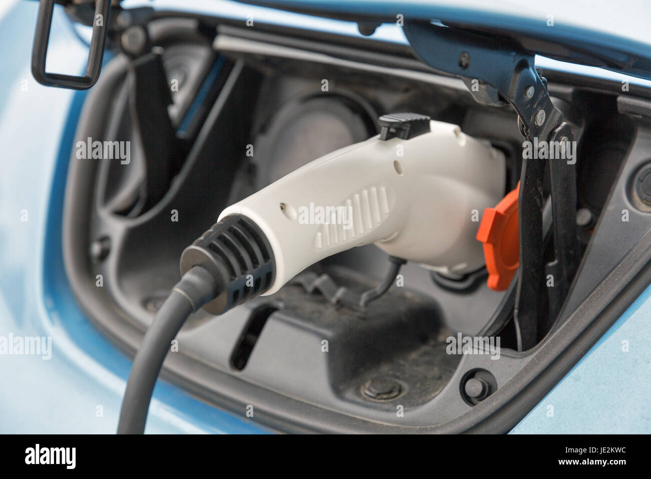 Charging an blue electric car closeup Stock Photo