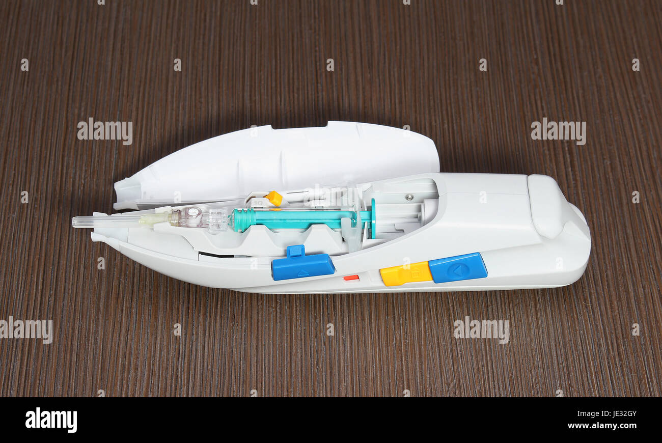 Plastic autoinjector for injecting medicine from prepared syringe Stock ...
