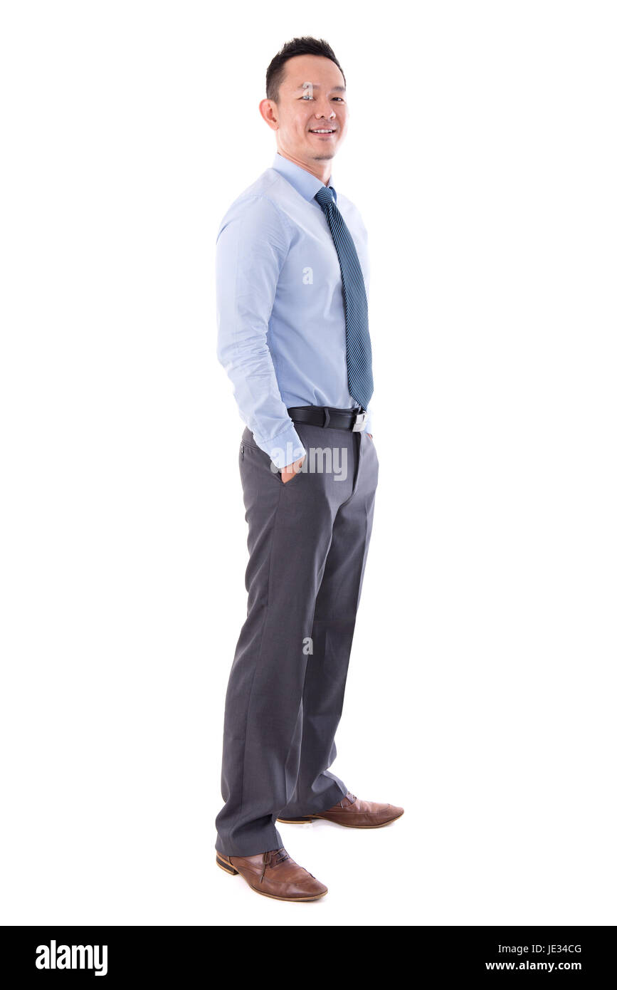 Asian business man smiling, full length standing isolated over white ...