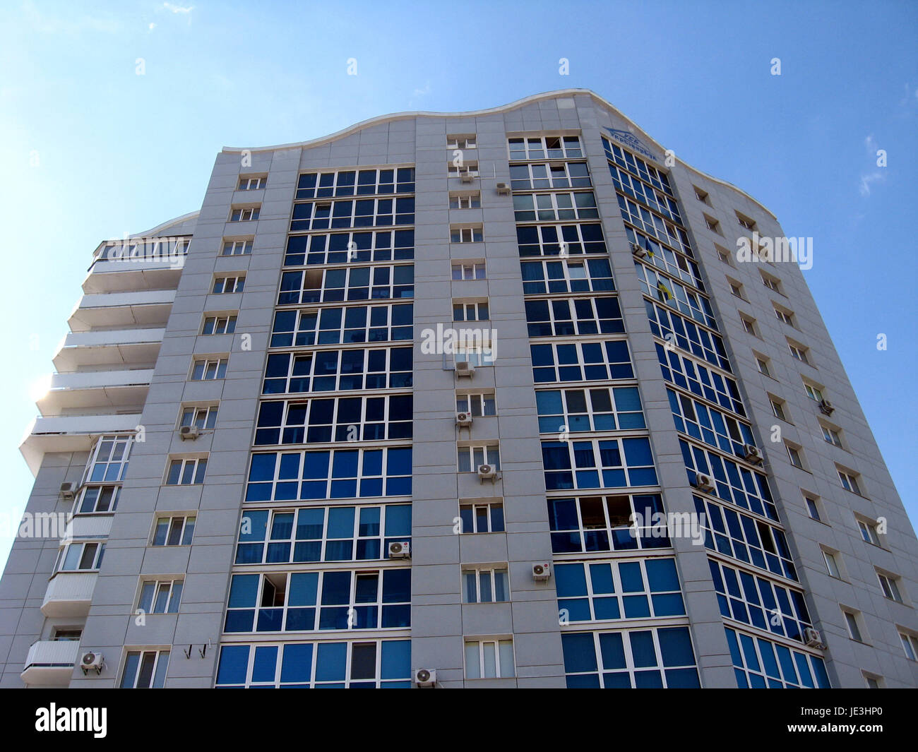 multistorey modern house on the blue sky background Stock Photo - Alamy