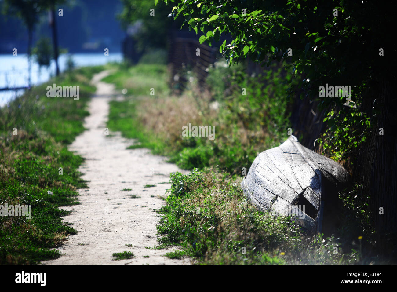Color picture of a wooden boat on a river bank Stock Photo - Alamy