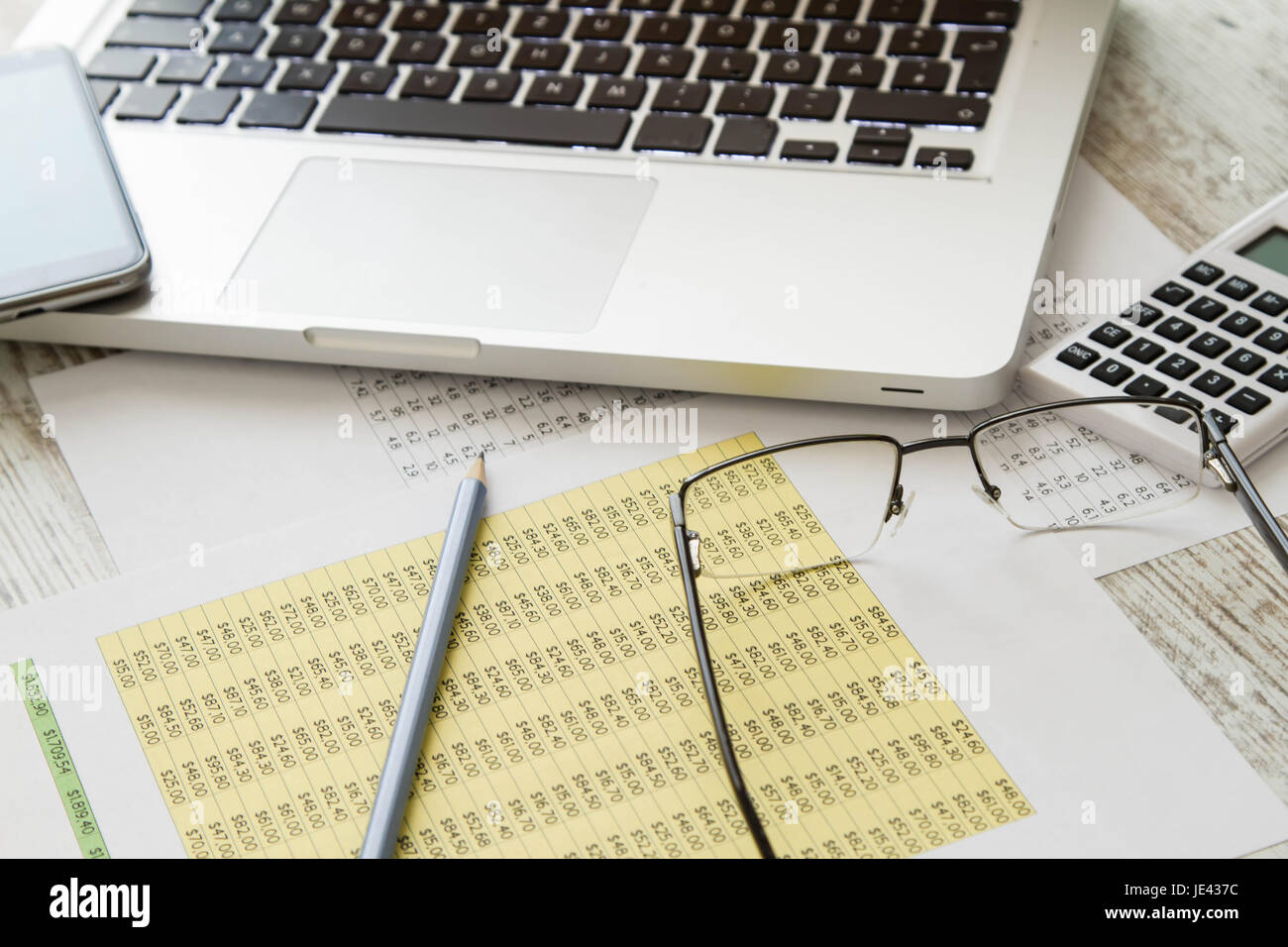Working, analyzing and doing calculations Stock Photo - Alamy