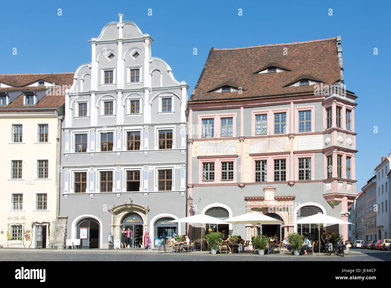 GOERLITZ, GERMANY - SEPTEMBER 5: Tourists at a cafe in the old town of Goerlitz, Germany on September 5, 2014. The historic town of Goerlitz is often used as film location. Foto taken from Untermarkt. Stock Photo