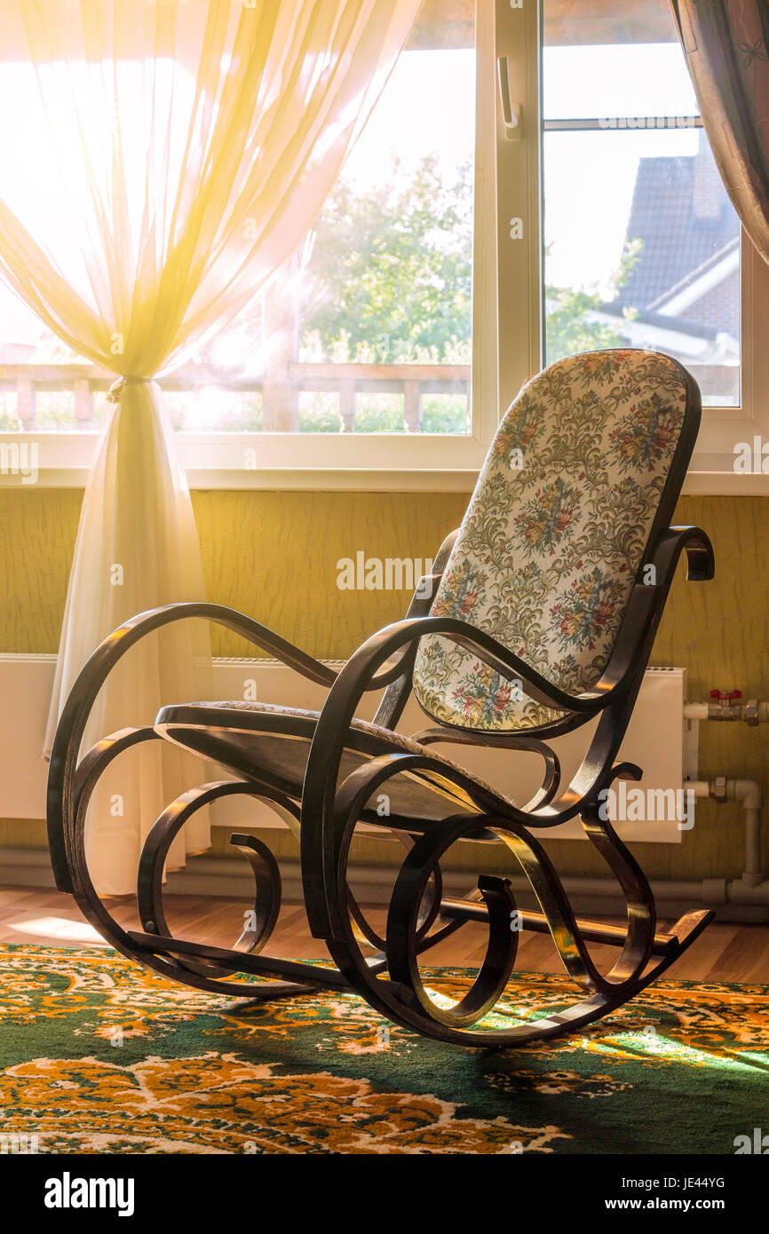 The rocking chair in the living room beside the window Stock Photo Alamy