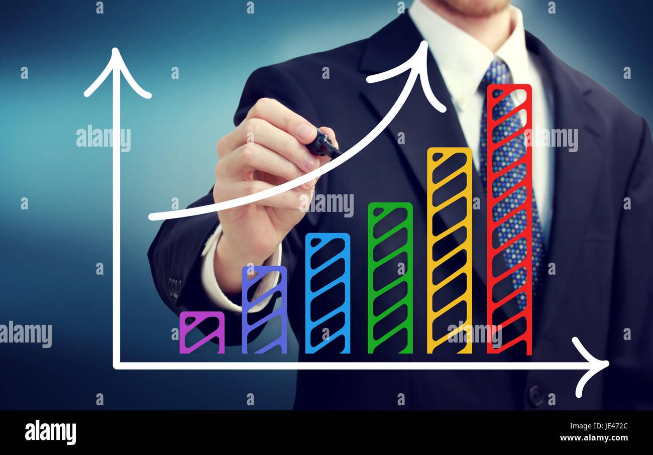 Businessman drawing a rising arrow over the colorful bar graph Stock ...