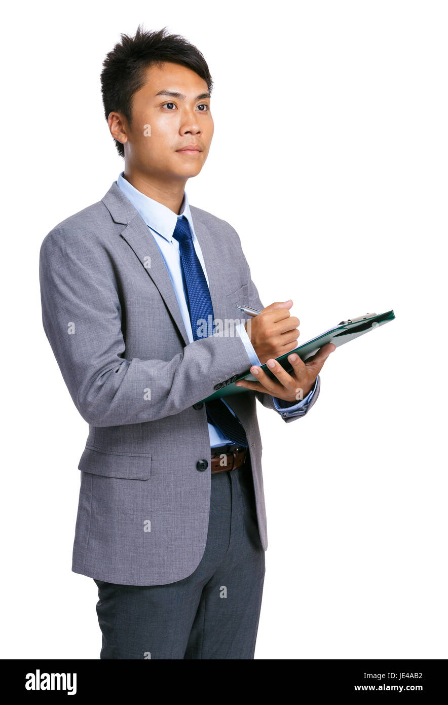 Businessman write on clipboard Stock Photo - Alamy
