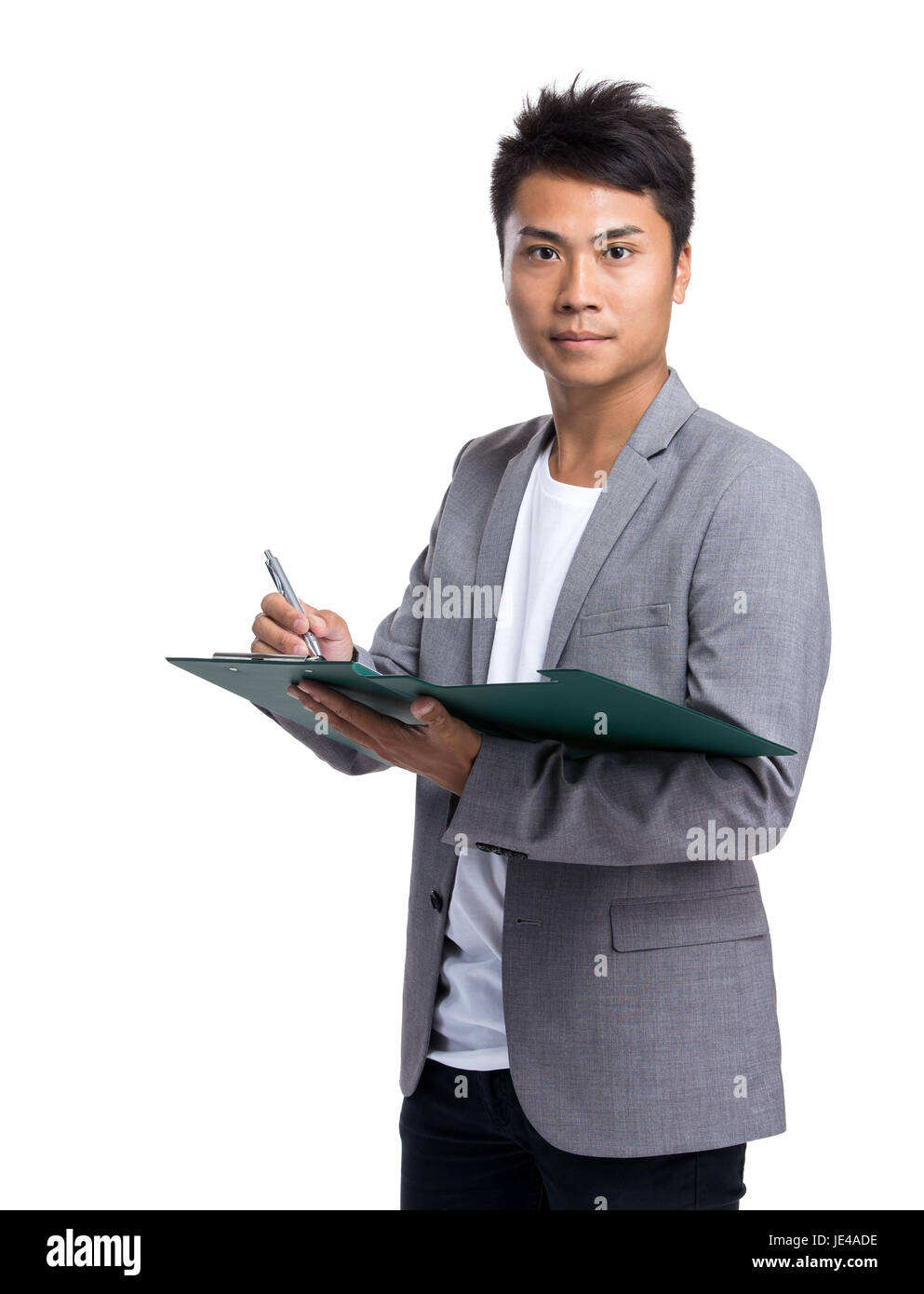 Businessman write on clipboard Stock Photo - Alamy