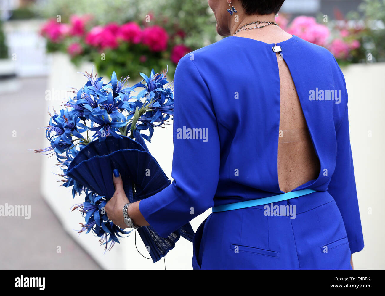 A woman arrives at ascot in a backless jumpsuit during day three of Royal Ascot at Ascot Racecourse. PRESS ASSOCIATION Photo. Picture date: Thursday June 22, 2017. See PA story RACING Ascot. Photo credit should read: Jonathan Brady/PA Wire. Stock Photo