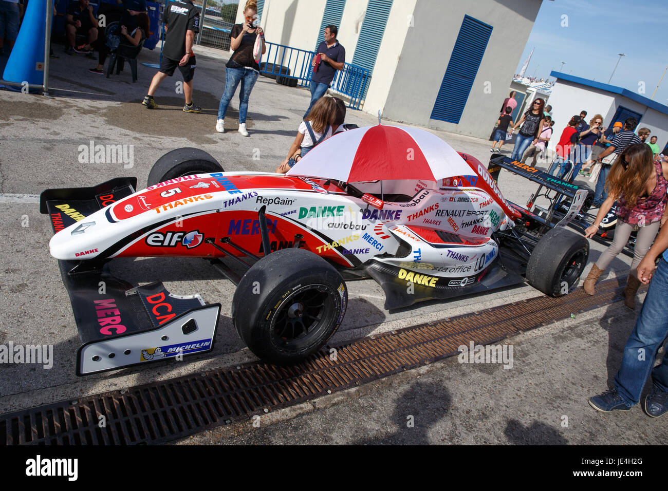 JEREZ DE LA FRONTERA, SPAIN - OCTOBER 19, 2014: People taking pictures with Levin Amweg's car of ART Junior Team at Jerez racetrack Stock Photo