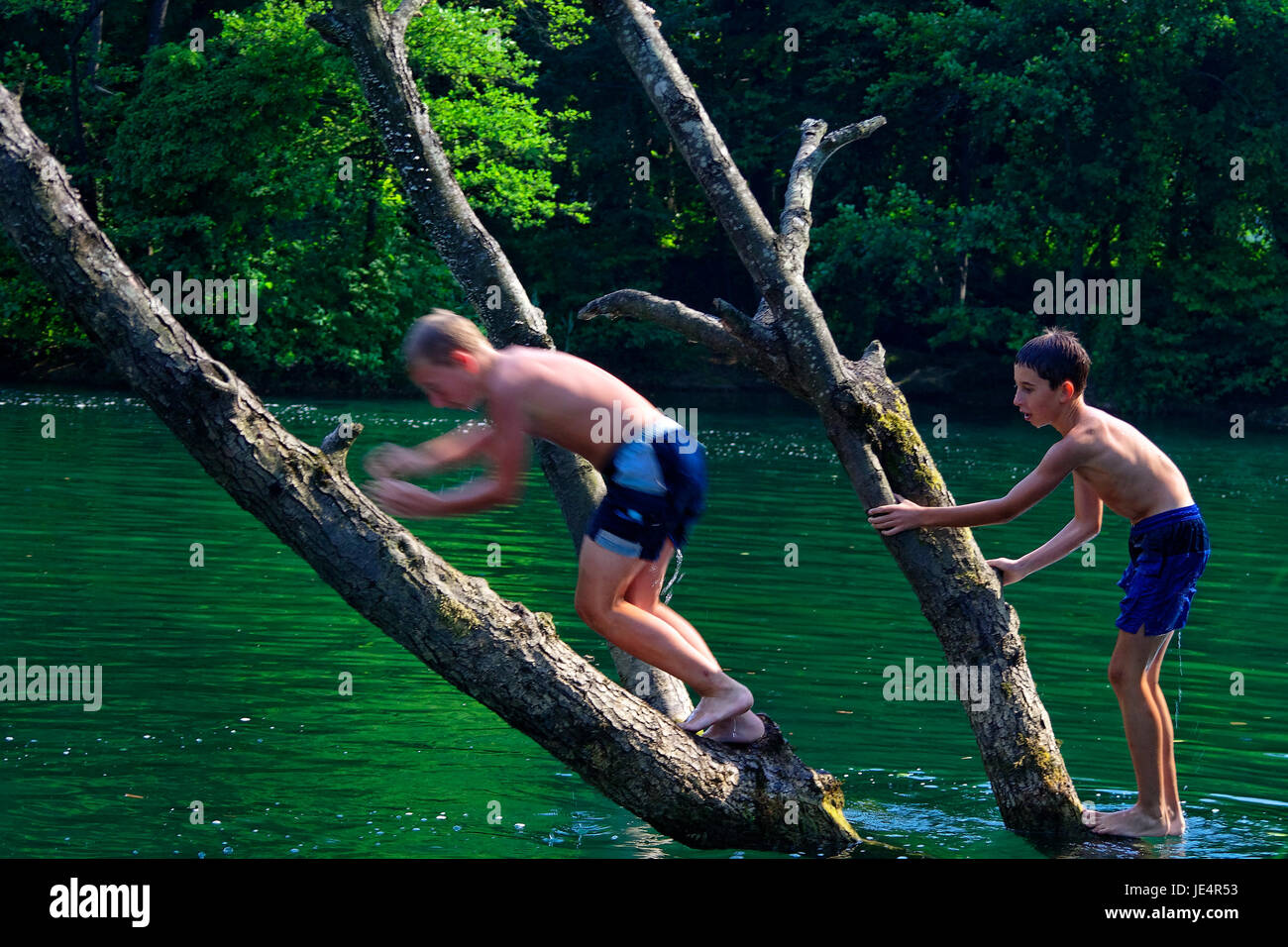 Boys jumping into river hi-res stock photography and images - Alamy
