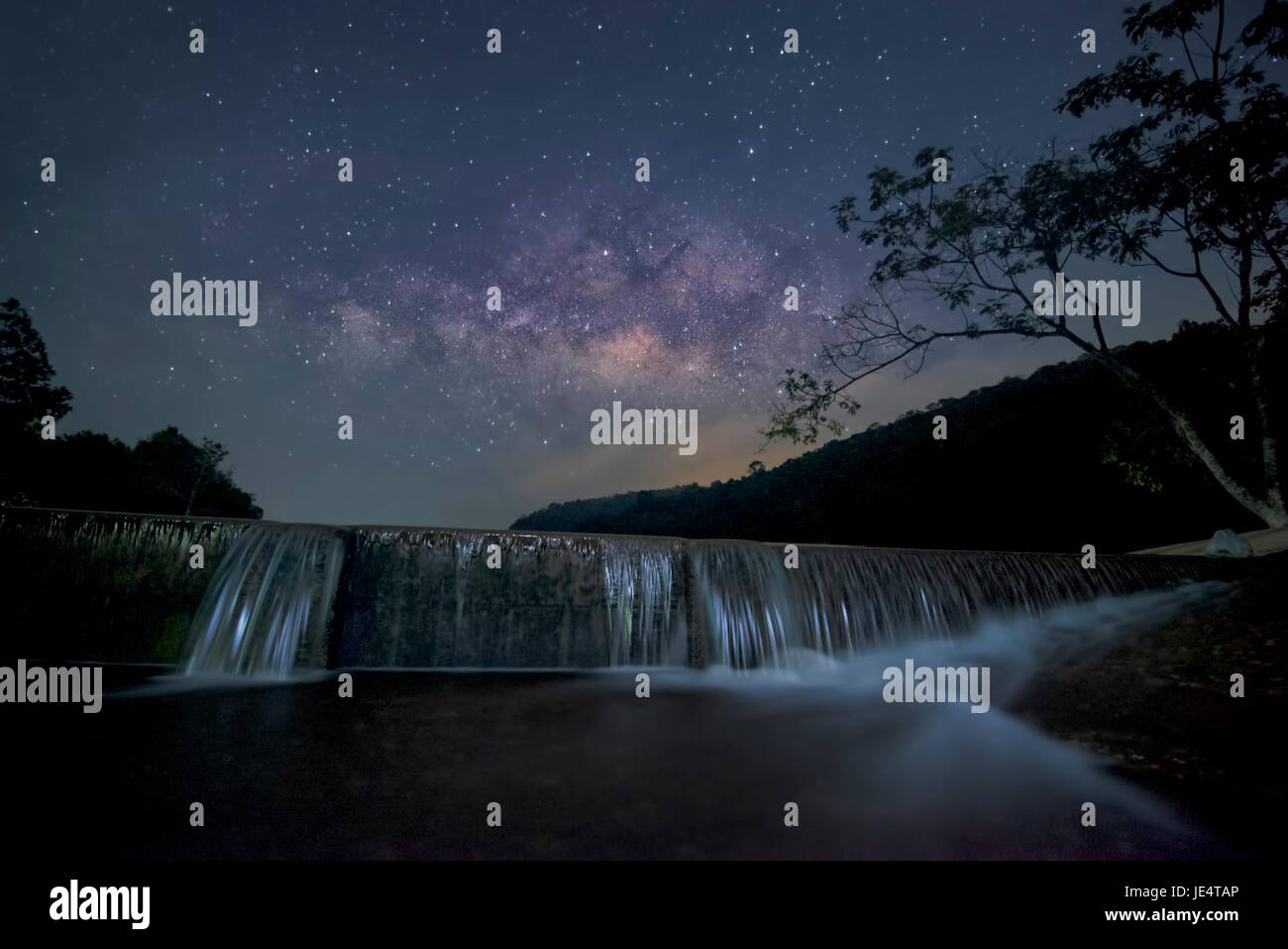 Milkyway over the small dam Stock Photo
