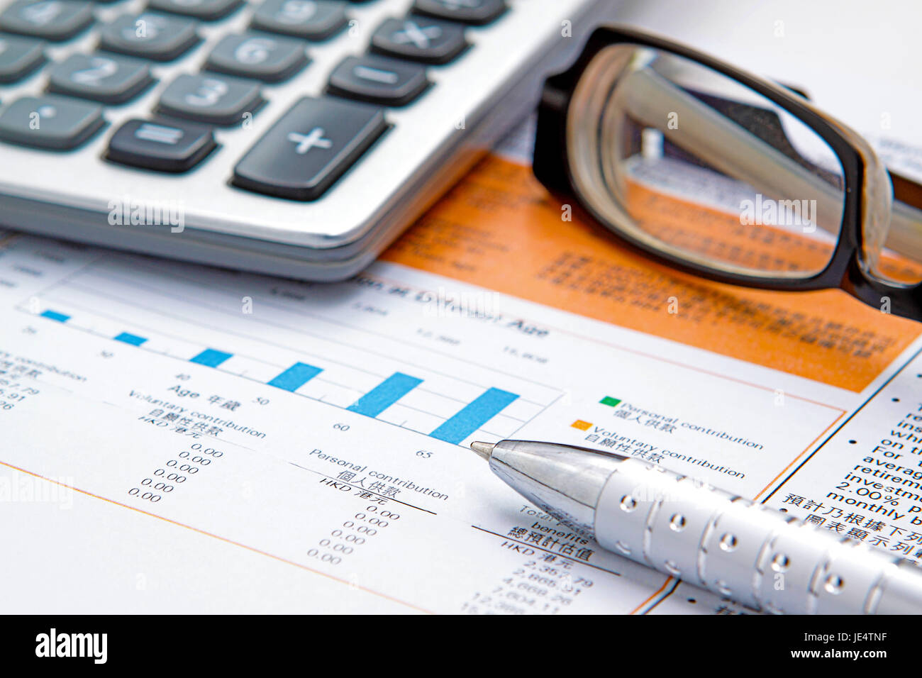 Stock chart with calculator,pen and eyeglasses Stock Photo Alamy