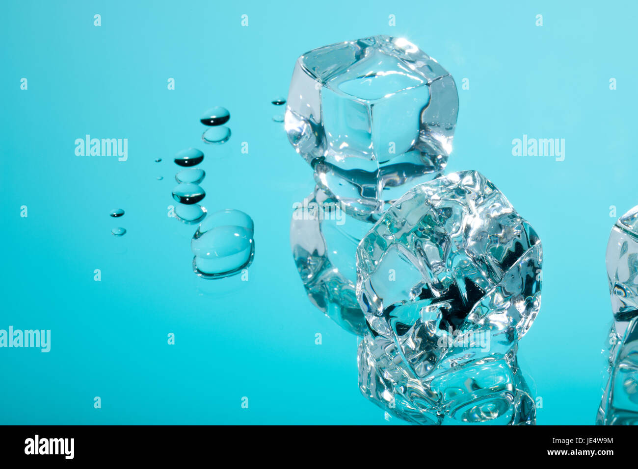 Acrylic ice cubes and drops of water. Stock Photo