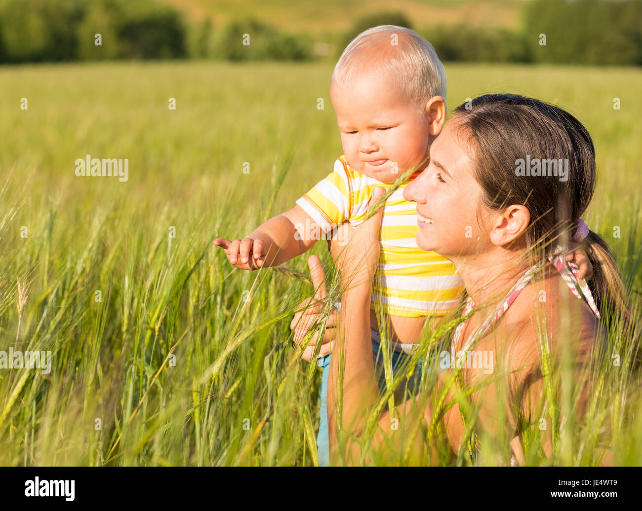 Baby and mom in wheat field Stock Photo Alamy